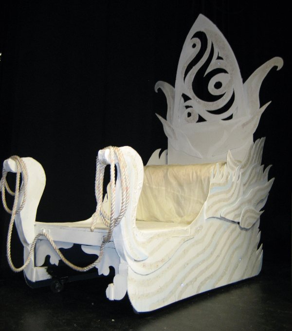 White ornate sleigh made out of a box