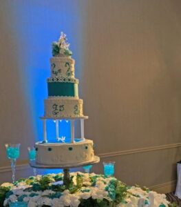 Uplights behind wedding cake